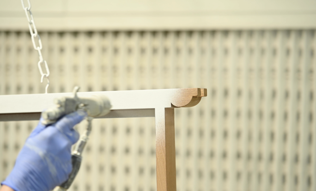 a sash window being sprayed